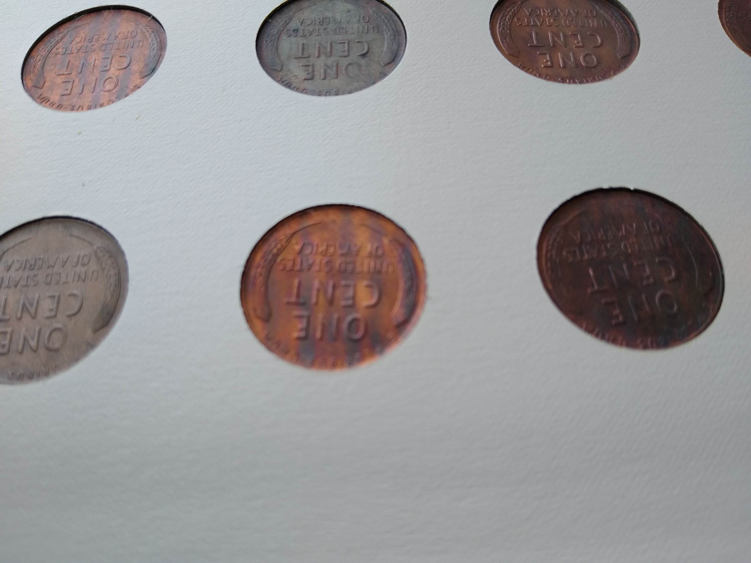 Unusual-Tarnishing-Over-15-Years-That-Coins-Have-Been-Stored-In-An-Album.-Any-Ideas-What-Caused-It?