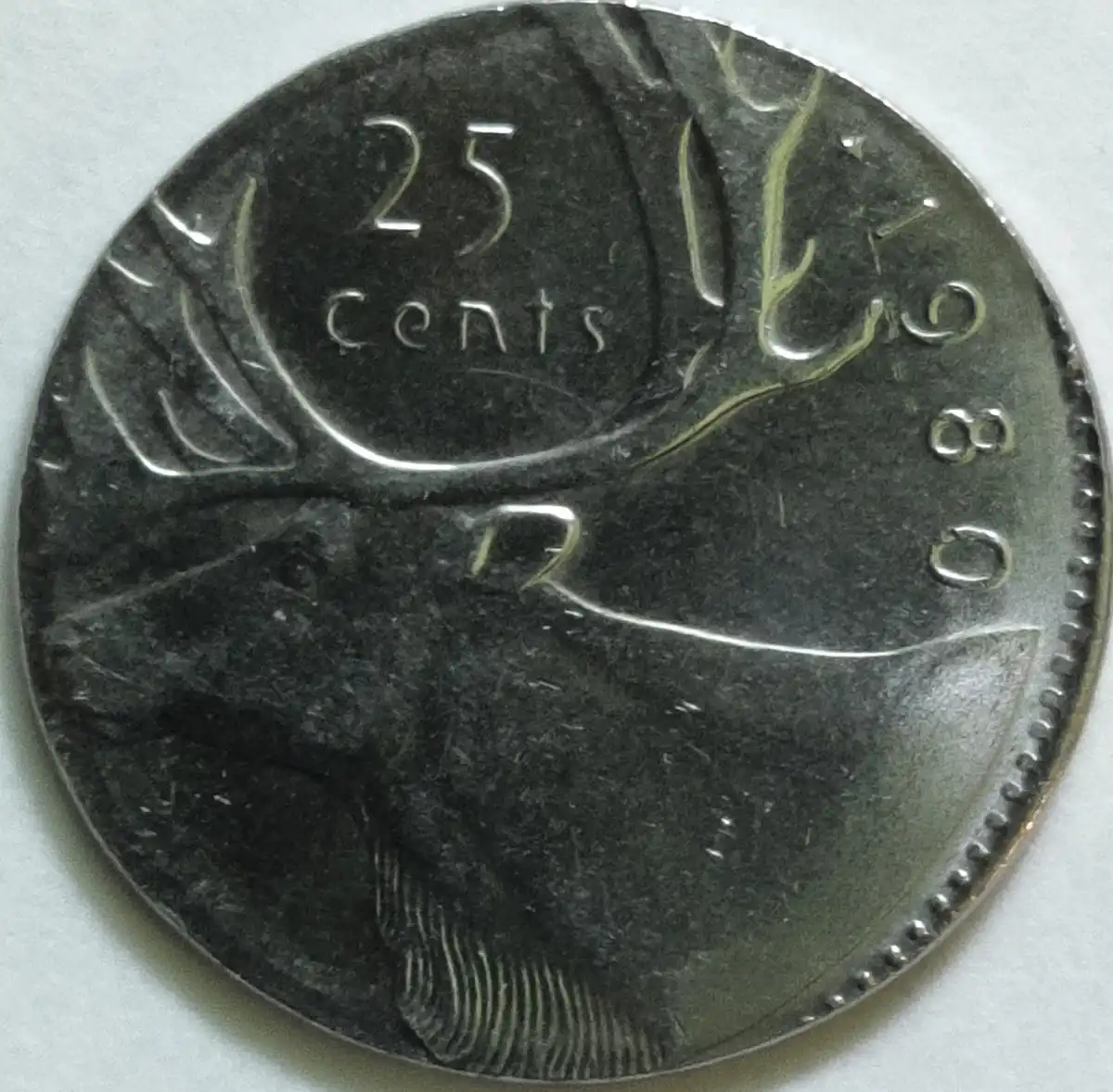 1980-25-Cent-Coin-On-A-10-Cent-Planchette?