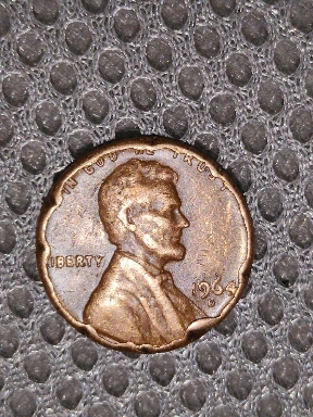 1961-D-Penny.-L-On-Rim?------1964-D-Penny.-Is-This-Mint-Error-Or-Damage?