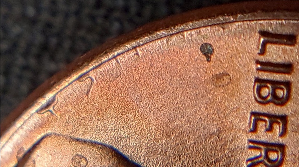1983-P-Lincoln-Cent-With-A-Secondary,-Incuse-&-Inverted,-Trust-In-The-Corner-Of-The-Rim-And-Field.