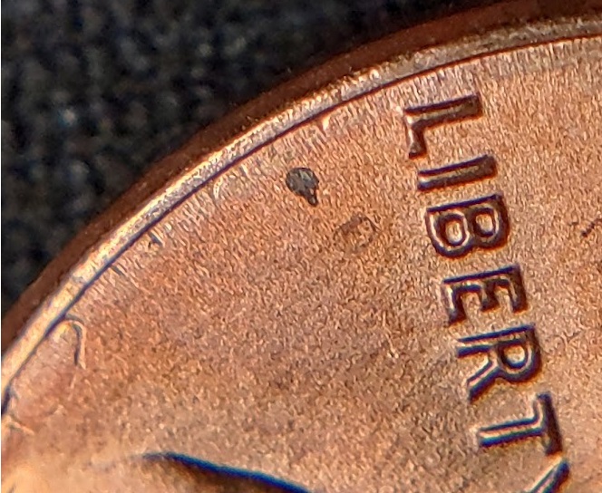 1983-P-Lincoln-Cent-With-A-Secondary,-Incuse-&-Inverted,-Trust-In-The-Corner-Of-The-Rim-And-Field.