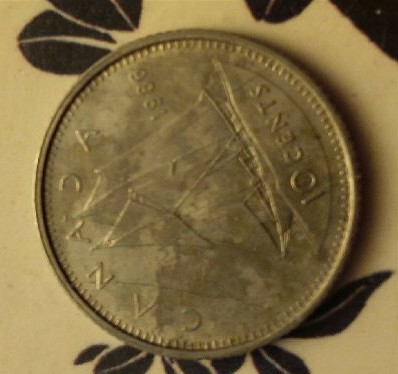 1986-10-Cent-Coin-With-Foreign-Errors
