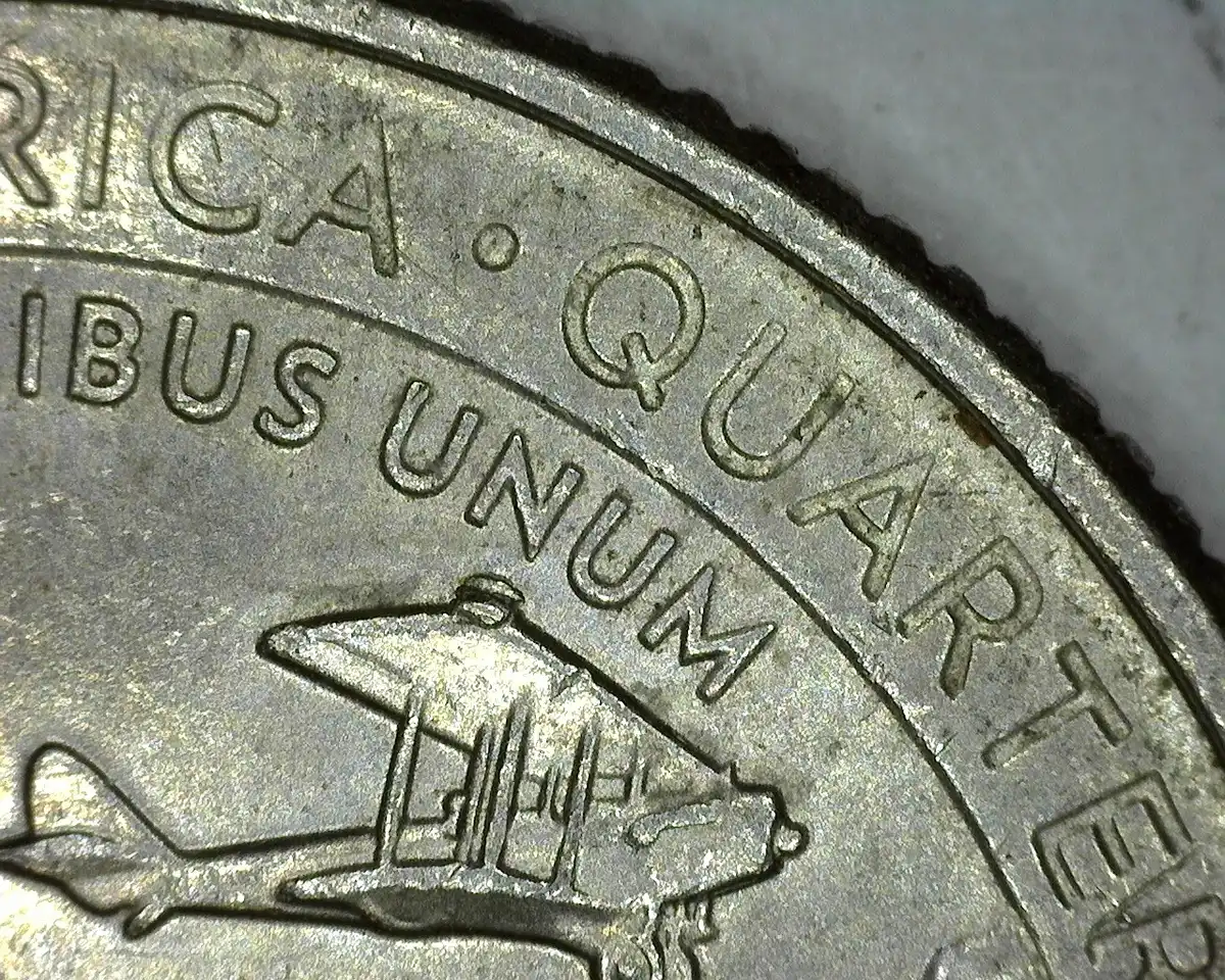 2023-P-BC-Quarter-With-Die-Chip-On-The-Wing