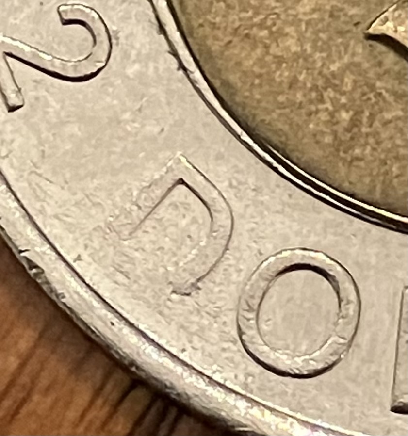 2000-Toonie:-Is-This-An-Error-Or-Post-Mint-Damage?