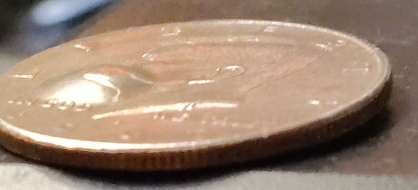 1997-D-Mint-Mark-Kennedy-Half-Dollar-With-Two-Bubbles-On-Each-Side.