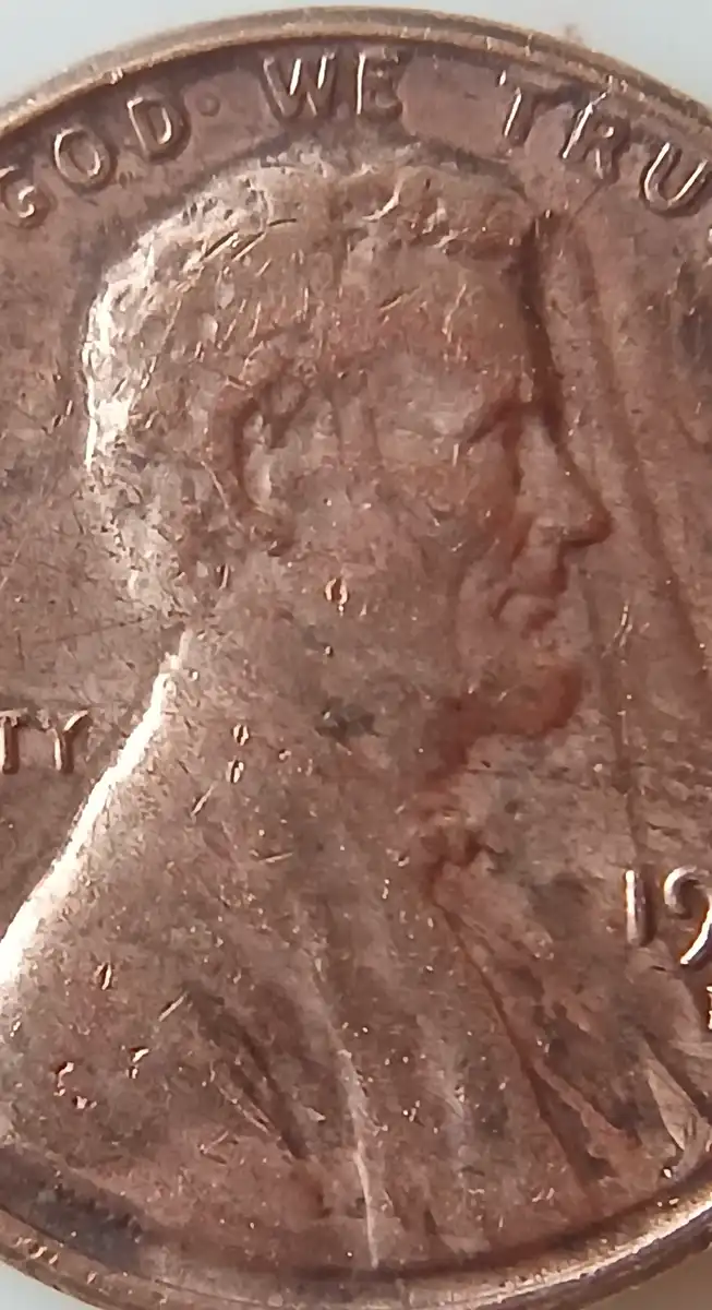 1970-Lincoln-Penny-With-Unknown-Design-In-Front-Of-The-Portrait.