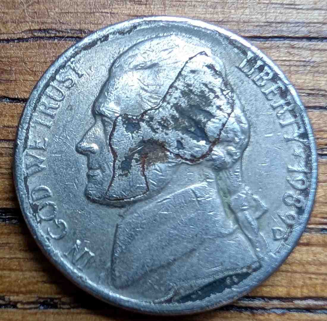 Jefferson-Nickel-Struck-In-Metal-Fragment