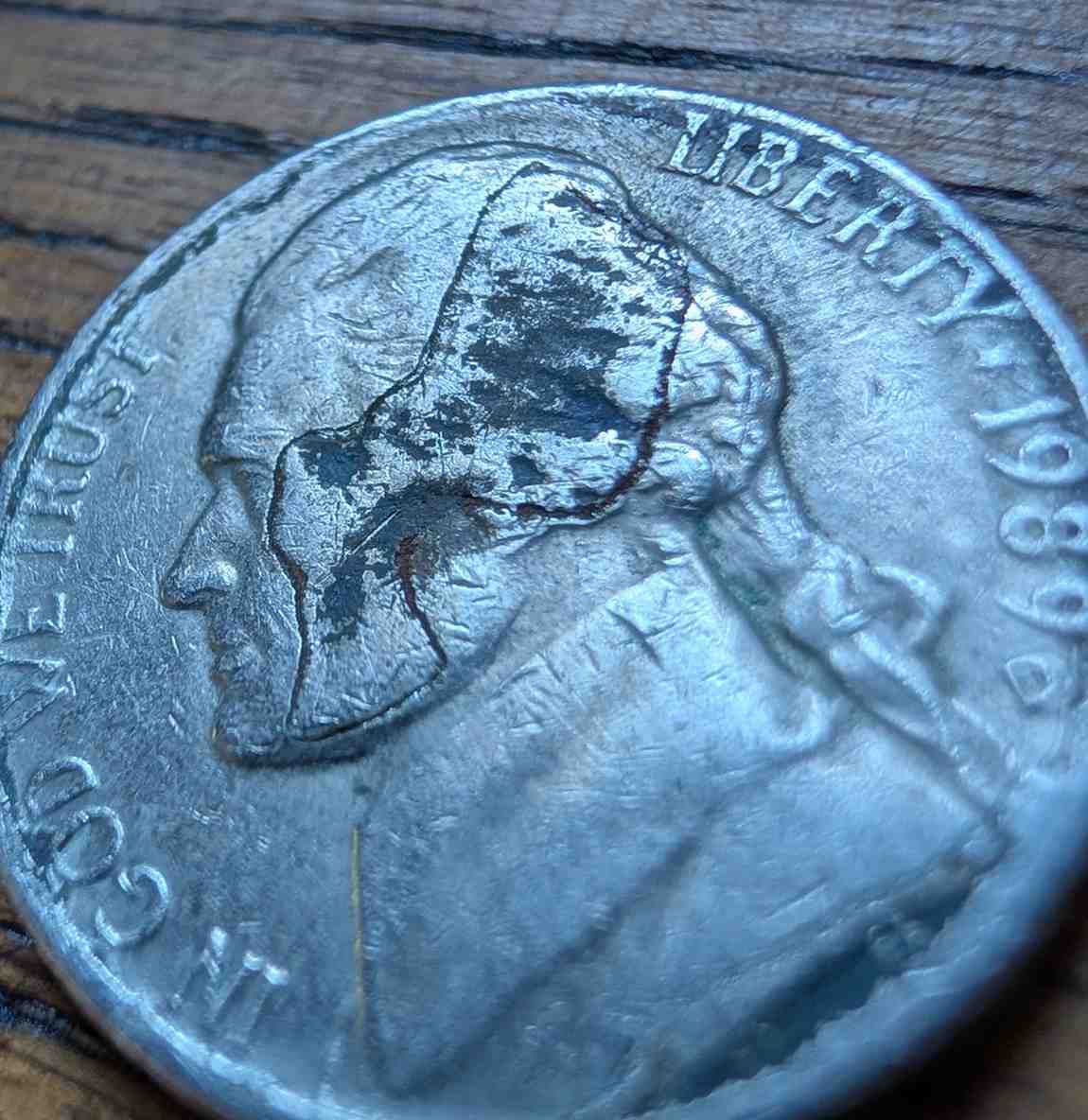 Jefferson-Nickel-Struck-In-Metal-Fragment