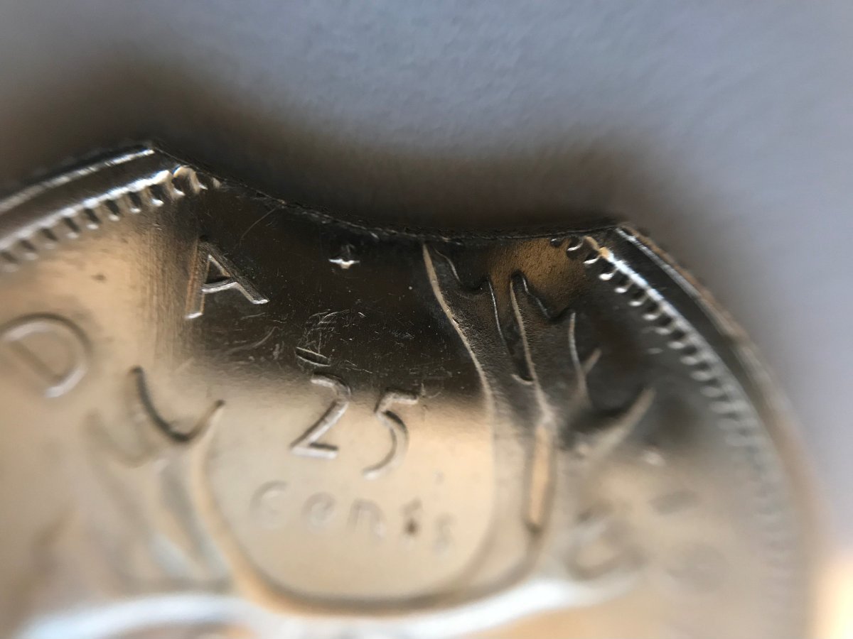 1975-25-Cents-Clipped-Planchet---Specimen-Strike