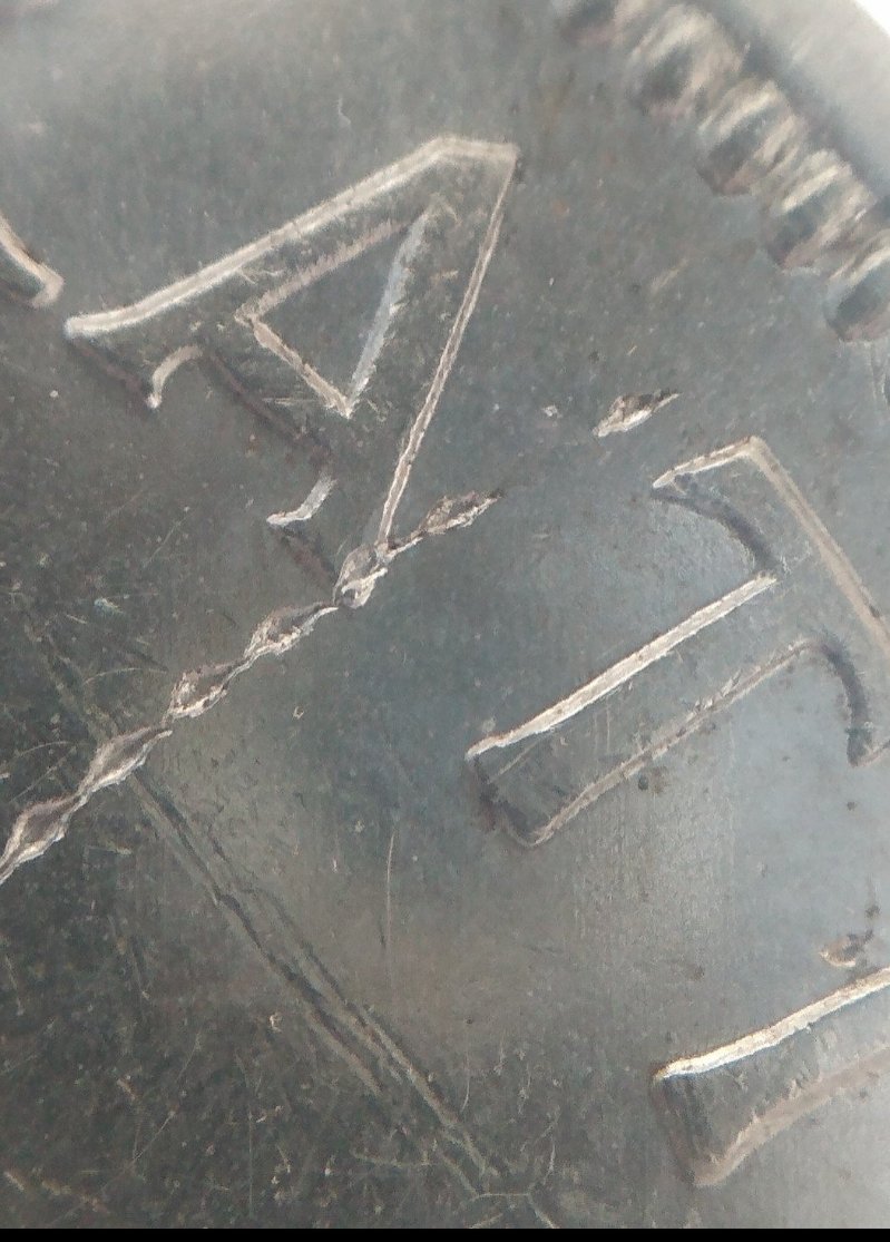 1955-Silver-Dollar-Struck-Through-Wire-On-Obverse-Close-Up-Pictures