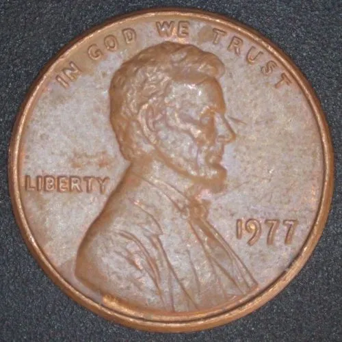 1977-LMC-Penny-/-Struck-Thru-Foil.-Retained-Break,-Or-Fin-Fold-Over?