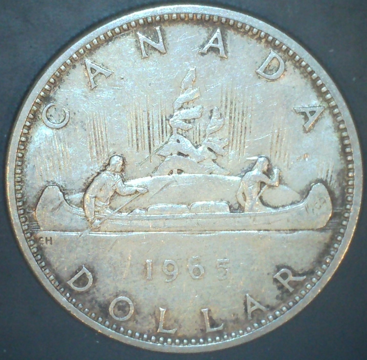 1965-Silver-Dollar---'6'-At-Odd-Angle.-Seeking-Information