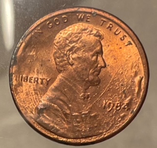 1984-Lincoln-Cent-Struck-Through-Grease?-Or-Is-Reverse-Struck-Through-Cloth?-Appreciate-Any-Help!
