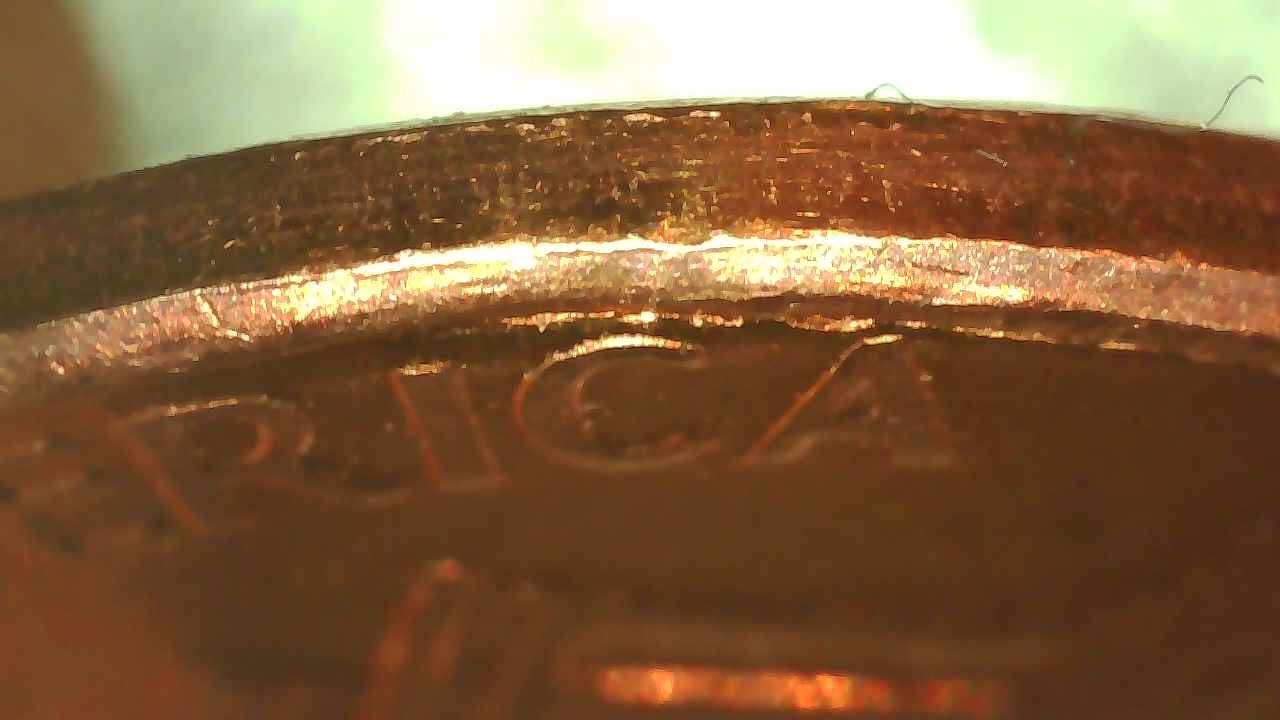 2007-Penny-With-Strange-Strike-On-Reverse-Rim