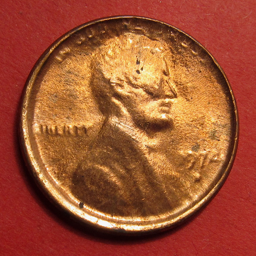1974-D-Lincoln-Memorial-Cent-Mint-Error---Struck-Through-Die-Cap-4-Coin-Progression