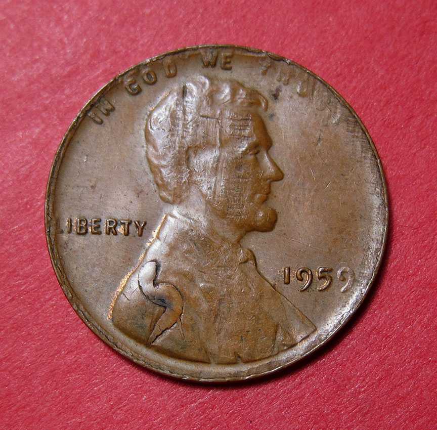 1959-Lincoln-Memorial-Cent-Mint-Error---Struck-Through-Split-Planchet-W/Superman-Retained