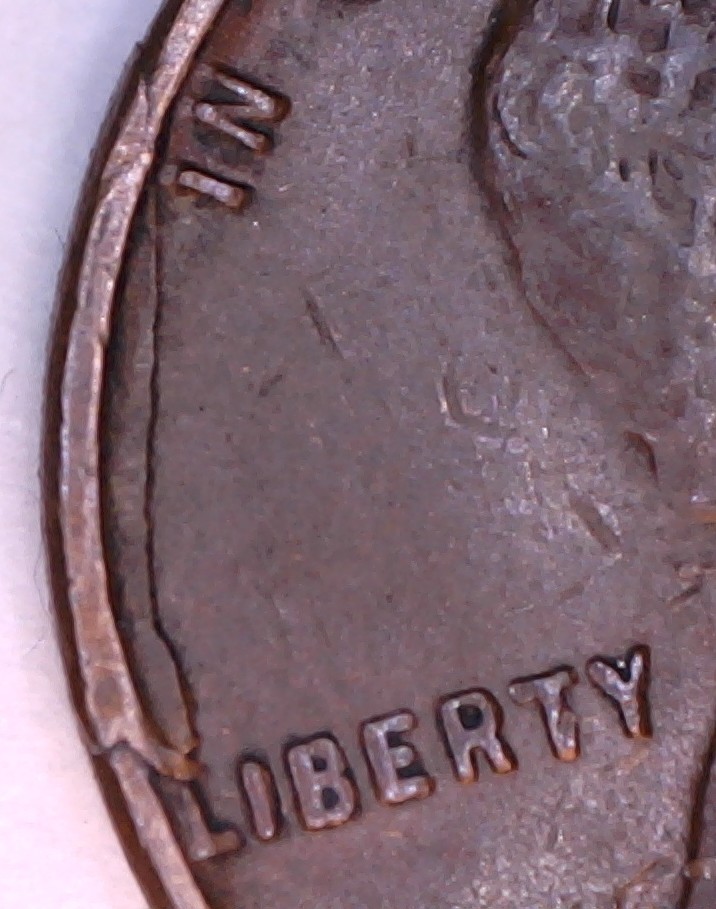 1949-Lincoln-Cent-Struck-Through-Folded-Rim-Fin