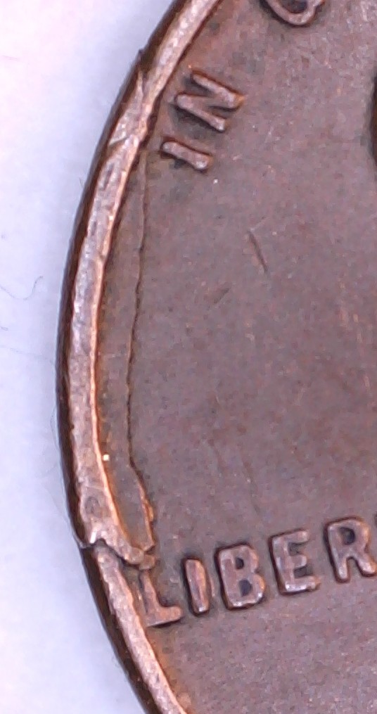 1949-Lincoln-Cent-Struck-Through-Folded-Rim-Fin