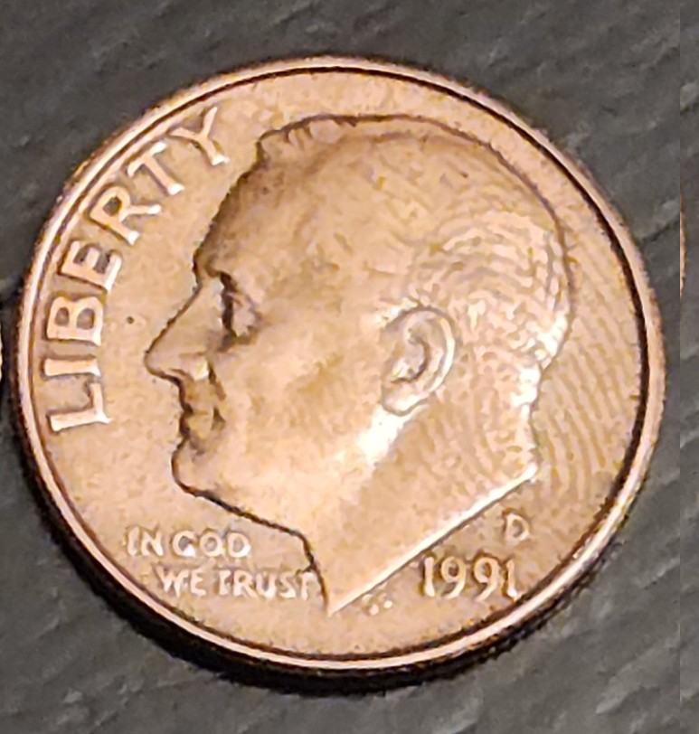 1991-Die-Clash-Dime-With-Thumbprint---Engraved.