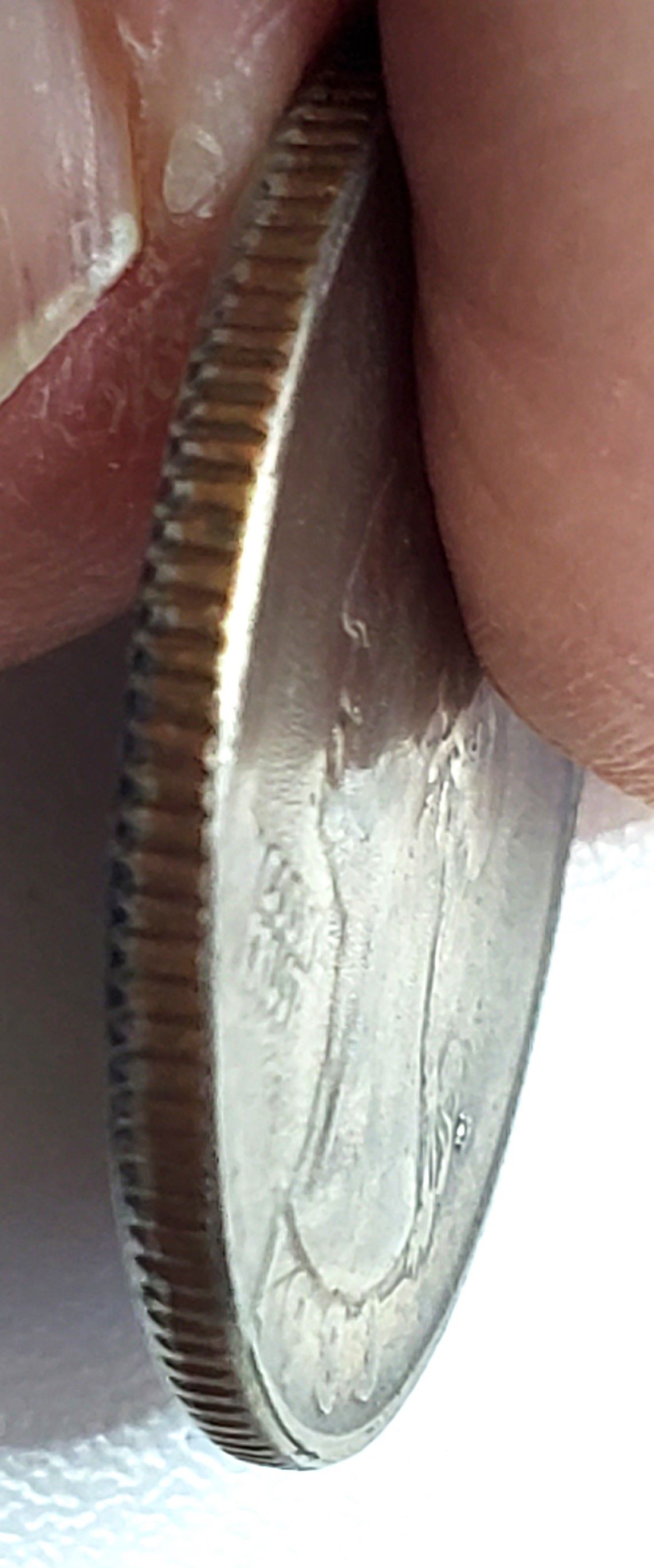 1983-P-Quarter-Strike-Through-Or-Dryer-Coin-Or-Worn-Die?