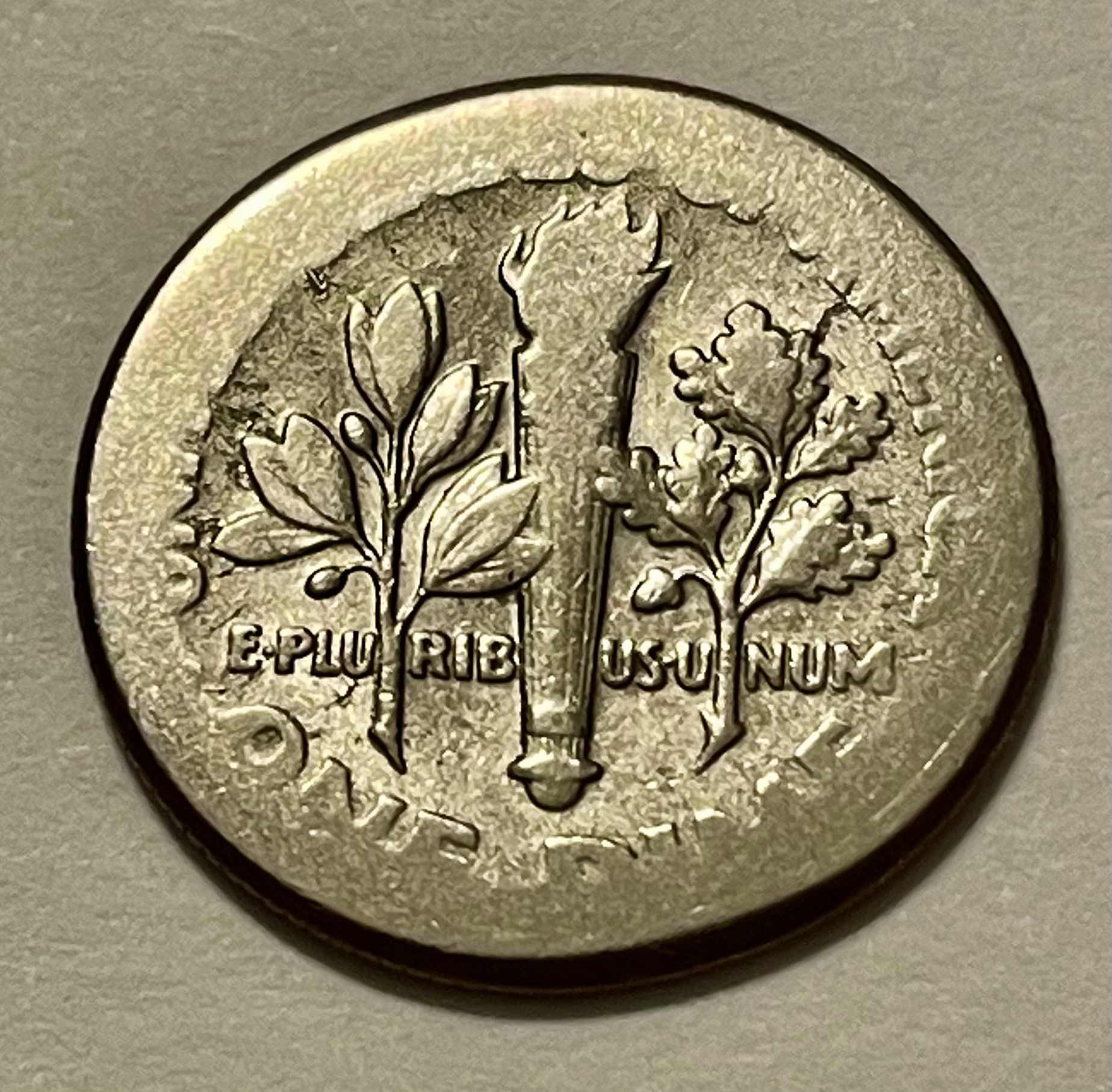 Unknown-Date-Clad-Roosevelt-Dime---Strike-Error-Or-PMD?