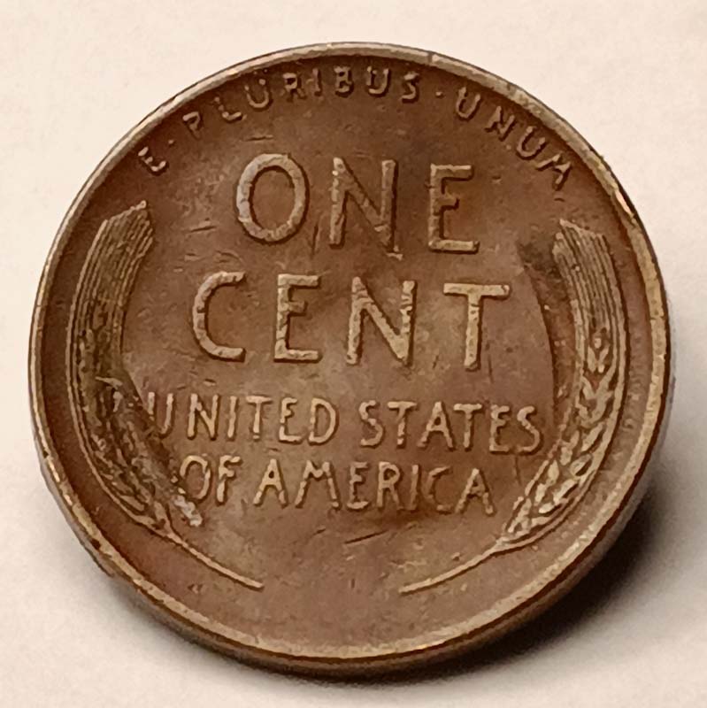 1955-D-Lincoln-Wheat-Cent-Strike-Through-Mint-And-Date-Stamps?