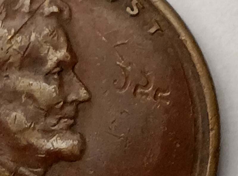 1955-D-Lincoln-Wheat-Cent-Strike-Through-Mint-And-Date-Stamps?