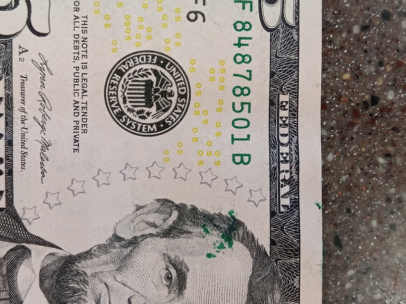 Green-Ink-Splatters-On-A-$5-Bill