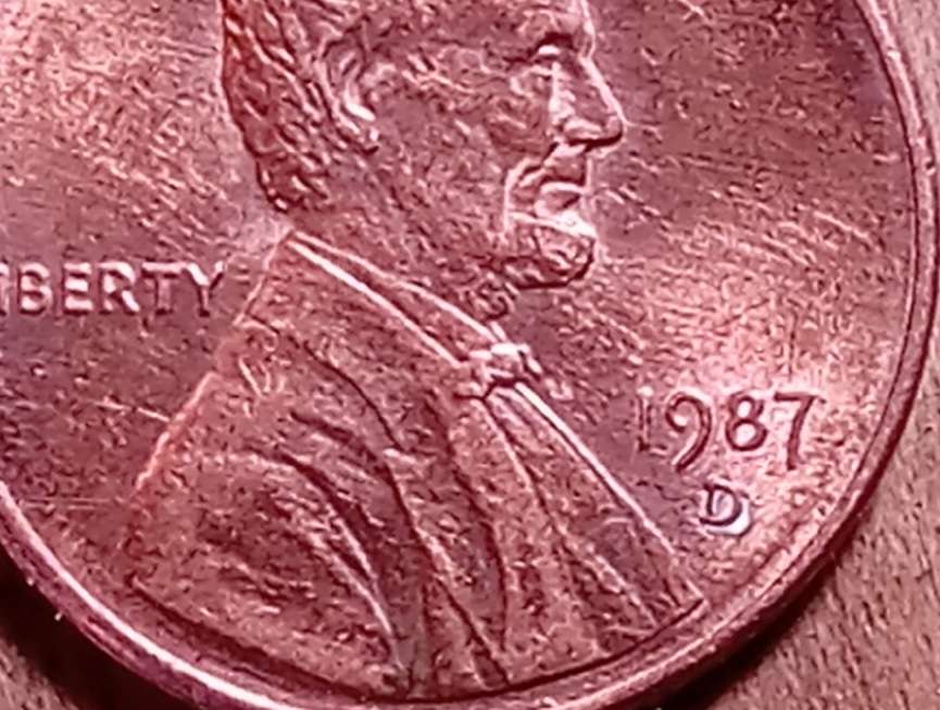 1987-D-Lincoln-Cent.-Is-It-A-Plating-Blister?-Caused-By-Heat-And-Air?