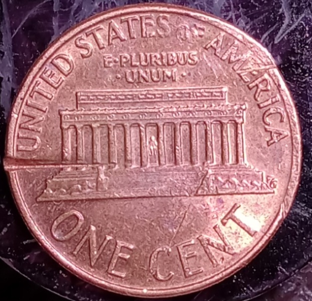 1974-P-1-Cent.-Is-This-Coin-Damaged-By-A-Feeder-Finger,-Or-Post-Mint?-Is-It-A-Denver-Minted-Coin?
