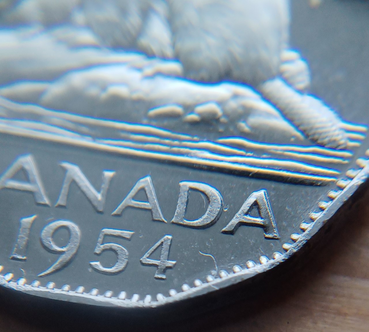 1954-Proof-Like-Nickel-That-Been-Through-A-Bit.