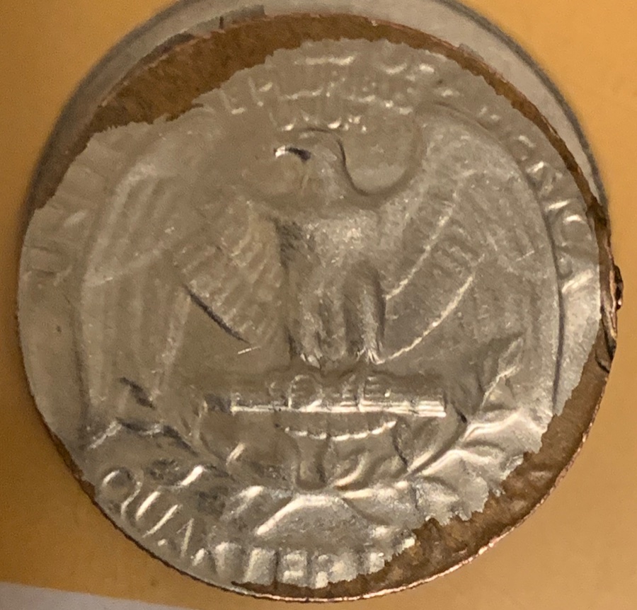 1965-Quarter-Stamped-On-A-Split-Planchet?