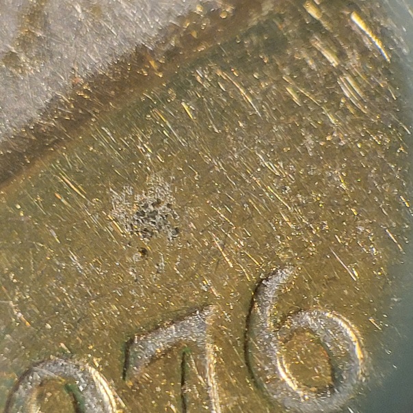 1976-Eisenhower-Dollar-Can't-Make-Out-A-MM-Gold-Plated-Maybe
