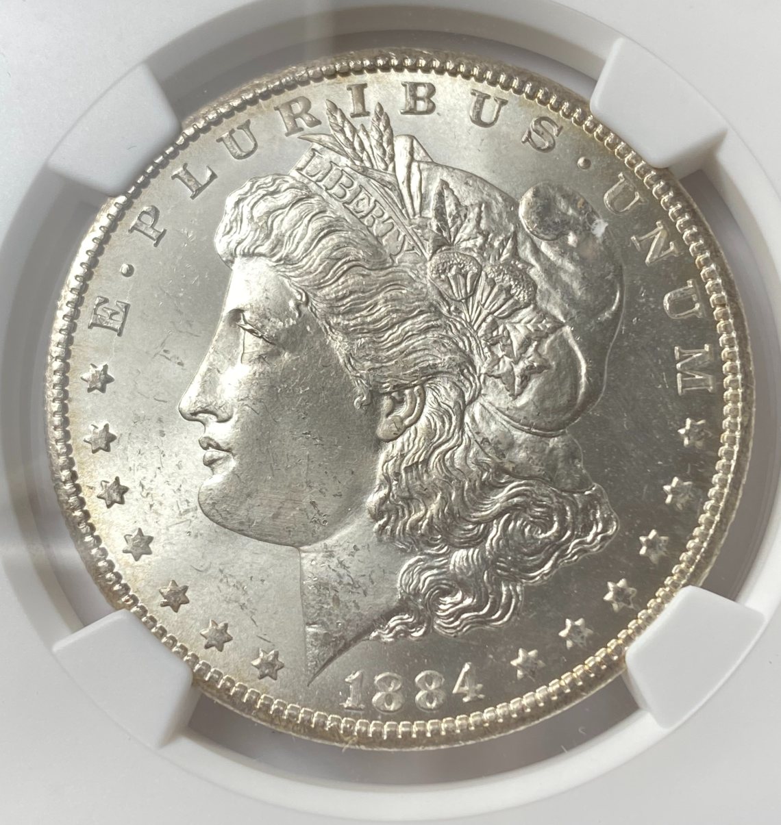 1884-CC-$1-Morgan-Silver-Dollar.-You-Vs.-NGC!