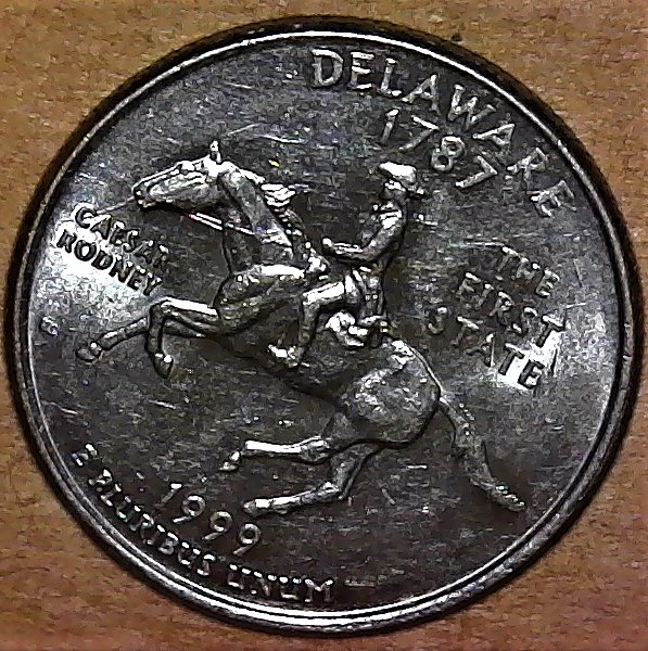 1999-P-Delaware-Quarter-Spitting-Horse-Error.-Yeahaa..