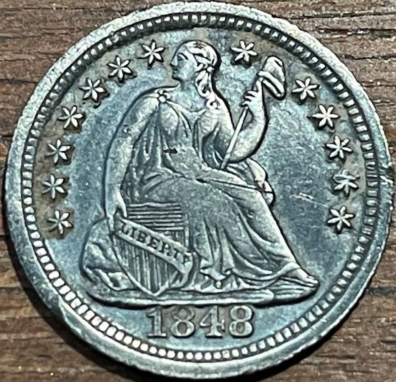 1848-Half-Dime,-Medium-Print-With-What-Looks-Like-Wear-On-The-A,-L,-And-I-On-The-Back.