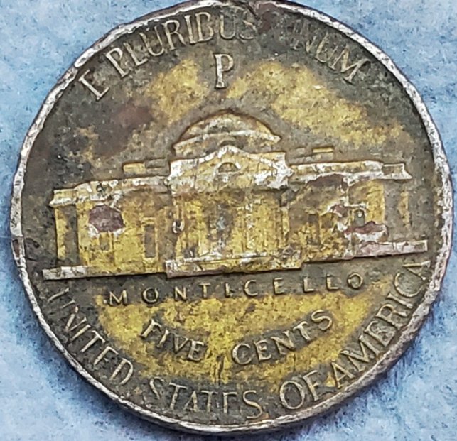 What-Is-This-Yellow-Tint-On-This-1944-P-War-Nickel?