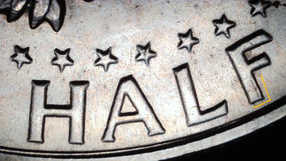 1968-D-Kennedy-Half-Dollar-With-MD-And-Something-Else.