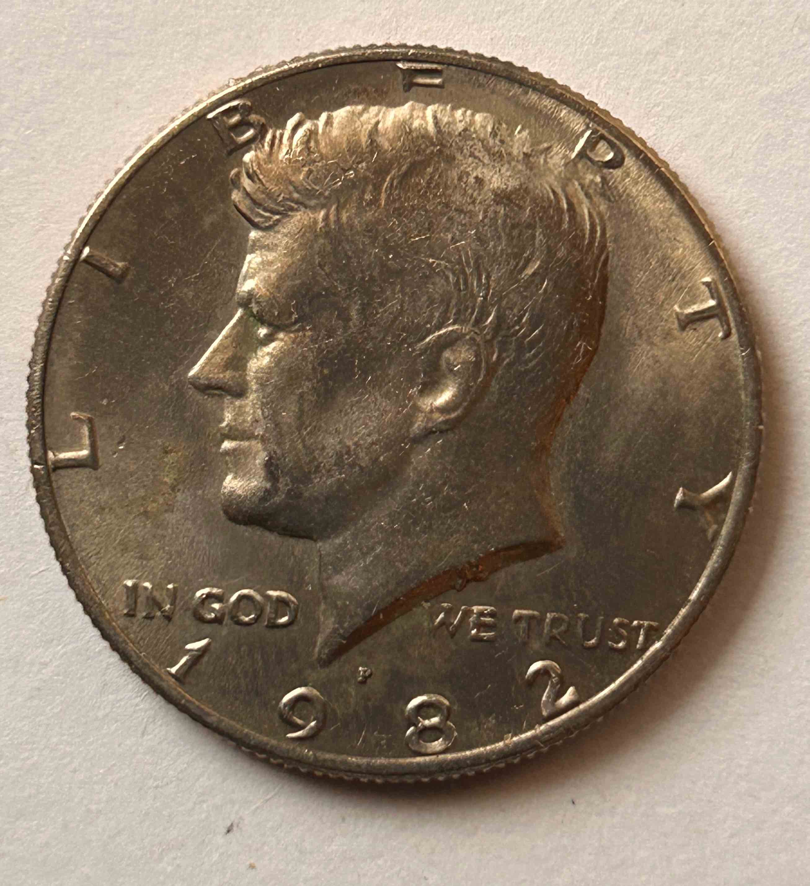1982-P-Mint-Kennedy-Half-Dollar.-Part-Of-E-Missing-In-Liberty.
