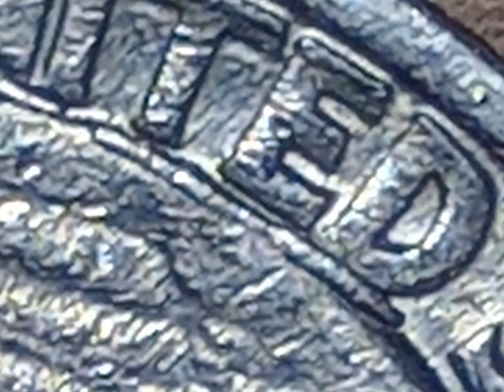1986-Washington-Quarter-With-A-Die-Chip-Under-United