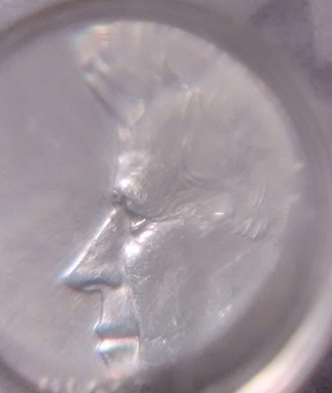 My-1964-Kennedy-Half-Dollar-Has-A-Hole-Between-The-Eyes-In-A-Way-And-3-A's