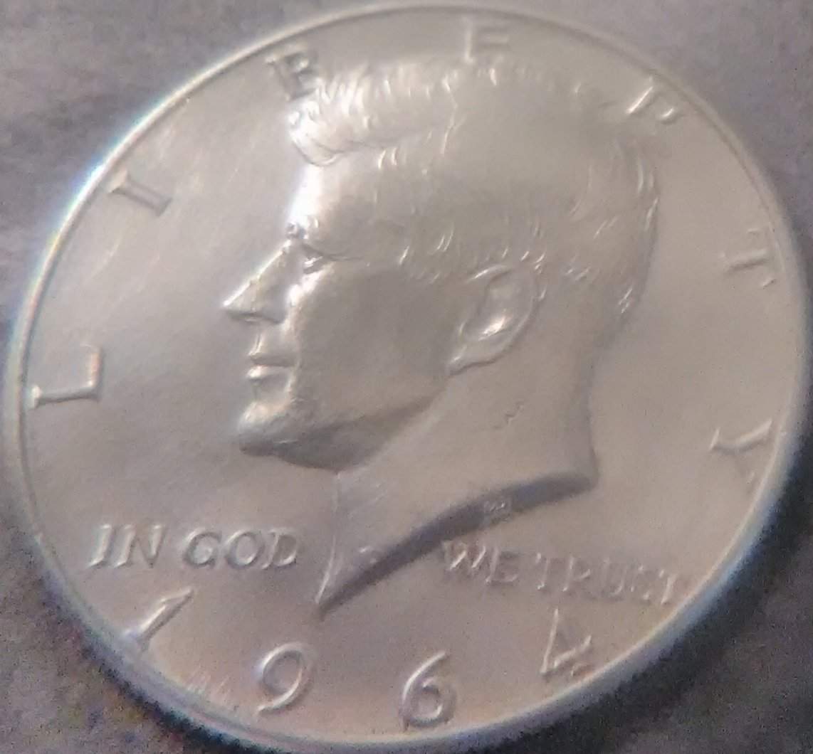 My-1964-Kennedy-Half-Dollar-Has-A-Hole-Between-The-Eyes-In-A-Way-And-3-A's