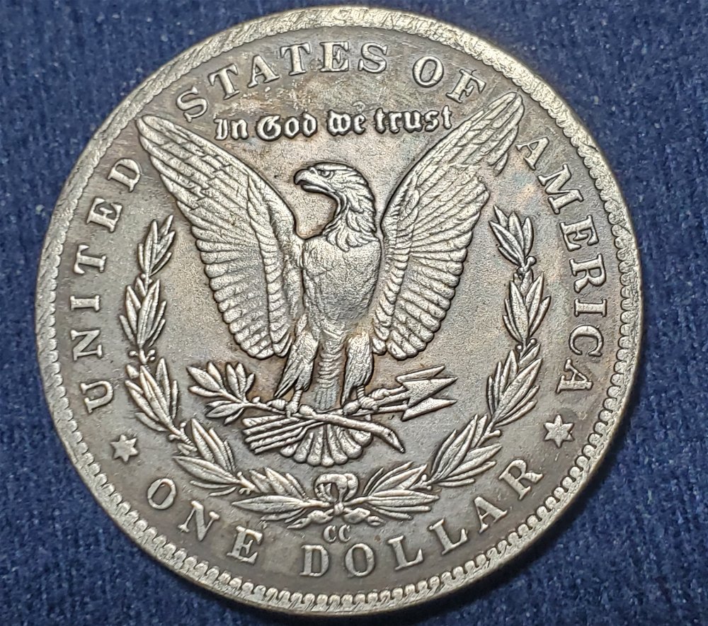 Broken-Left-Wing-On-1889-Morgan-CC--Flat-With-Rest-Of-Coin-Surface