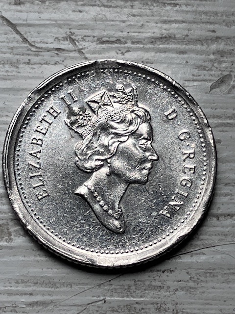 Strange-Rim-On-2000-Dime