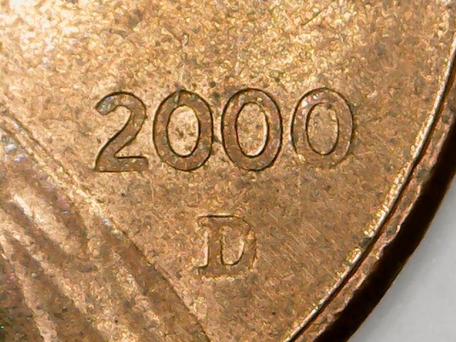 Cent:-Ghost-Letters-Or-Struck-Through-Grease?