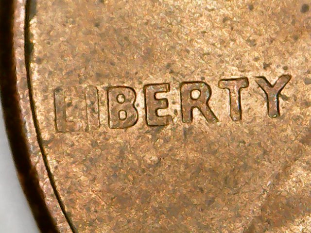 Cent:-Ghost-Letters-Or-Struck-Through-Grease?