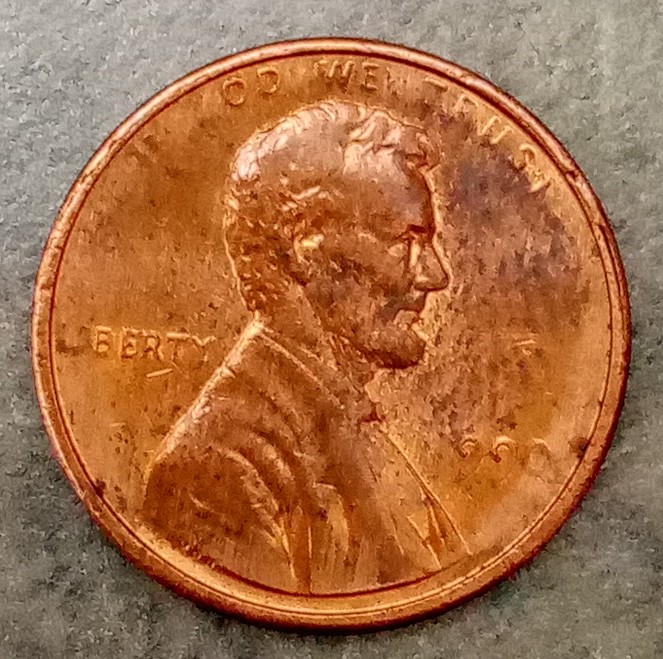 1990?-Penny-Appears-To-Be-Struck-Through-Grease?