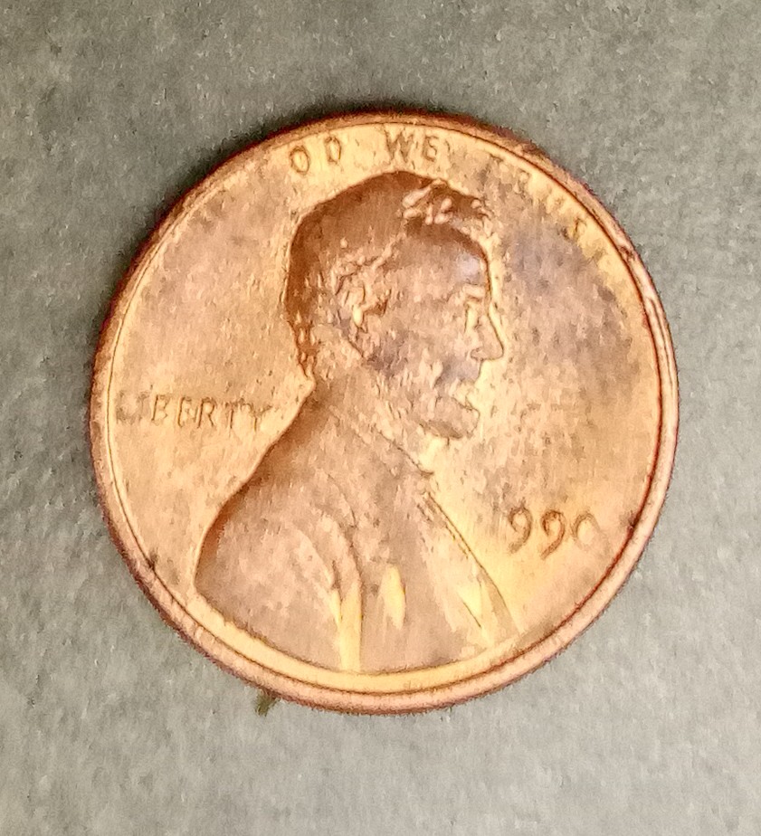 1990?-Penny-Appears-To-Be-Struck-Through-Grease?