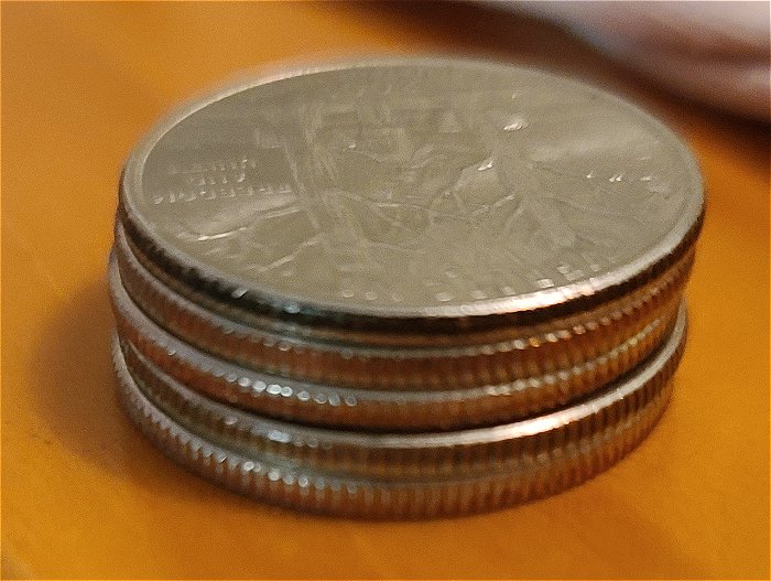 What-Causes-The-Copper-Color-On-The-Rim-Of-Quarter-To-Turn-Black?