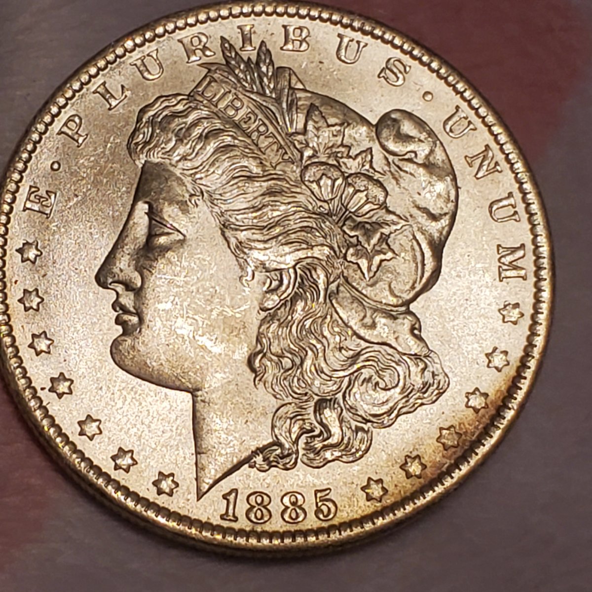 1885-O-Morgan-Dollar-Toned.-Any-Idea-Of-Grade-Or-Value?